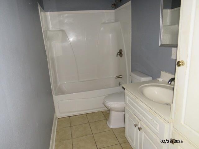 full bathroom featuring toilet, vanity, shower / bathing tub combination, and tile patterned floors