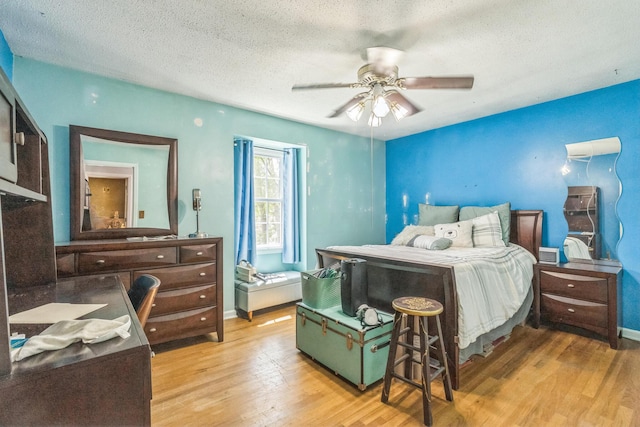 2917 Westchester Ct, Augusta, GA 30909 - bedroom featuring light wood-type flooring, a textured ceiling, and ceiling fan