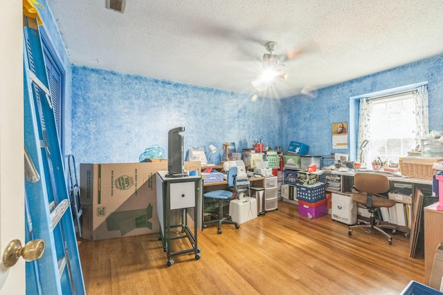 2917 Westchester Ct, Augusta, GA 30909 - home office with wallpapered walls, wood finished floors, a ceiling fan, and a textured ceiling