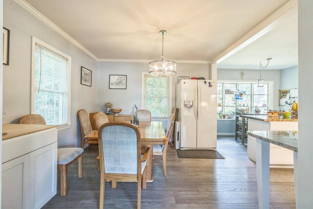 2917 Westchester Ct, Augusta, GA 30909 - dining space with wood finished floors, a chandelier, and crown molding
