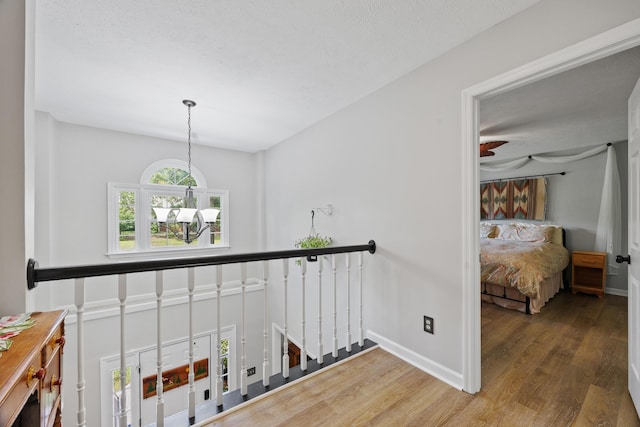 534 Creekridge Rd, Aiken, SC 29803 - corridor with wood finished floors, a chandelier, and an upstairs landing