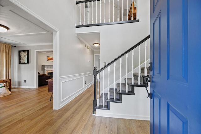 534 Creekridge Rd, Aiken, SC 29803 - foyer featuring wood finished floors, stairway, a fireplace, and crown molding