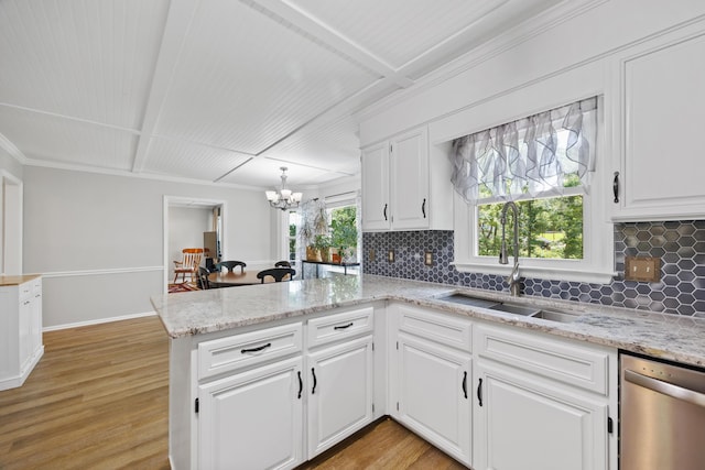 534 Creekridge Rd, Aiken, SC 29803 - kitchen featuring stainless steel dishwasher, a peninsula, backsplash, a chandelier, and light wood-style floors