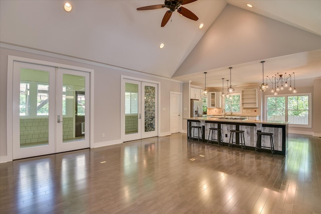 525 Brigham Trl, Augusta, GA 30909 - unfurnished living room featuring french doors, recessed lighting, ceiling fan, high vaulted ceiling, and dark wood-style flooring