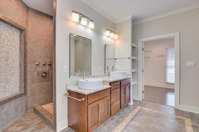 525 Brigham Trl, Augusta, GA 30909 - bathroom with wood finished floors, double vanity, a walk in shower, crown molding, and a spacious closet