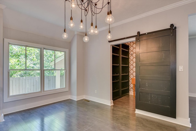 525 Brigham Trl, Augusta, GA 30909 - spare room with a barn door, dark wood-style floors, crown molding, and a chandelier