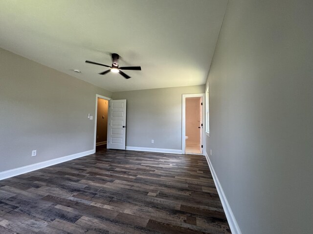3112 Fieldstone Cir, Augusta, GA 30907 - unfurnished bedroom with dark wood-style floors, baseboards, ensuite bathroom, and a ceiling fan