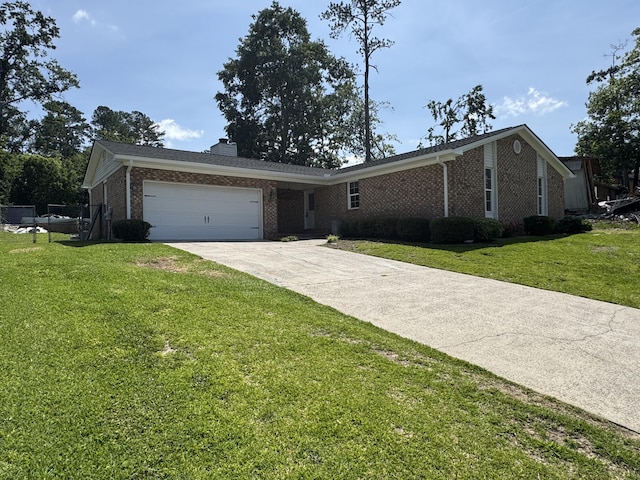 3112 Fieldstone Cir, Augusta, GA 30907 - view of front of home with brick siding, concrete driveway, a garage, a chimney, and a front yard