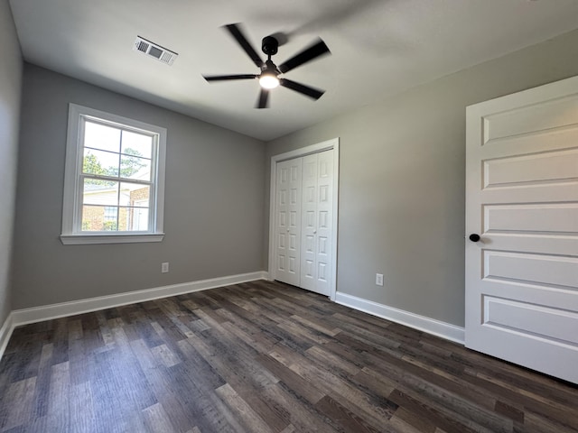 3112 Fieldstone Cir, Augusta, GA 30907 - unfurnished bedroom featuring dark wood-type flooring, a closet, baseboards, and ceiling fan
