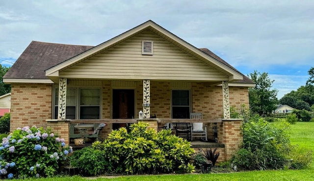 289 Cathy Dr, Warrenville, SC 29851 - view of front of property featuring covered porch, brick siding, and a shingled roof