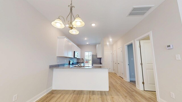 full bathroom featuring vanity, bathtub / shower combination, hardwood / wood-style floors, and toilet