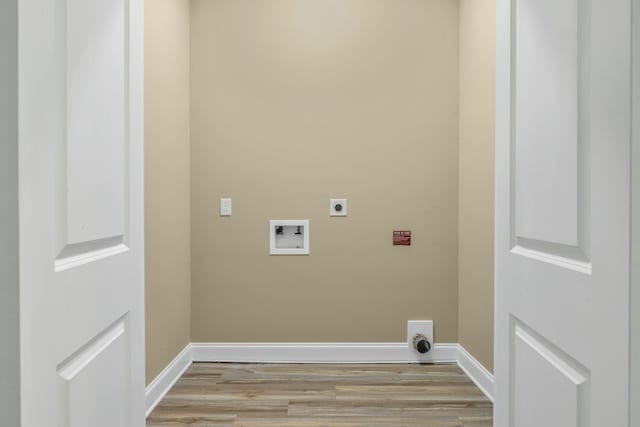 laundry area with electric dryer hookup, light hardwood / wood-style floors, and hookup for a washing machine