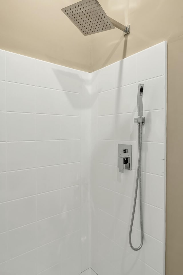 bathroom with a tile shower