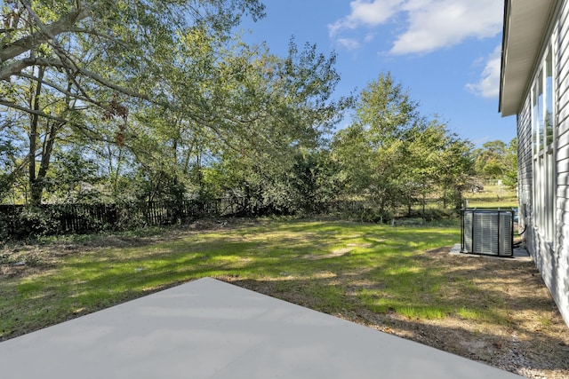 view of yard with a patio area and central AC