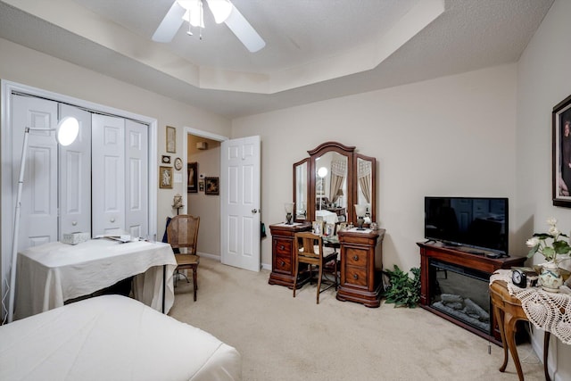543 Cranberry Cir, Grovetown, GA 30813 - bedroom featuring light colored carpet, a closet, a ceiling fan, baseboards, and a raised ceiling