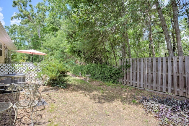 543 Cranberry Cir, Grovetown, GA 30813 - view of yard featuring central AC, fence, and outdoor dining area