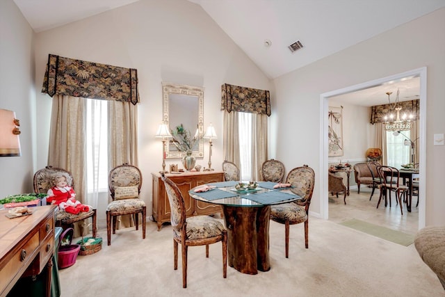 543 Cranberry Cir, Grovetown, GA 30813 - dining space with a chandelier, light carpet, and high vaulted ceiling