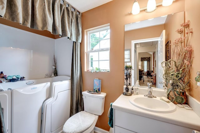 543 Cranberry Cir, Grovetown, GA 30813 - bathroom featuring vanity, toilet, and a tub to relax in