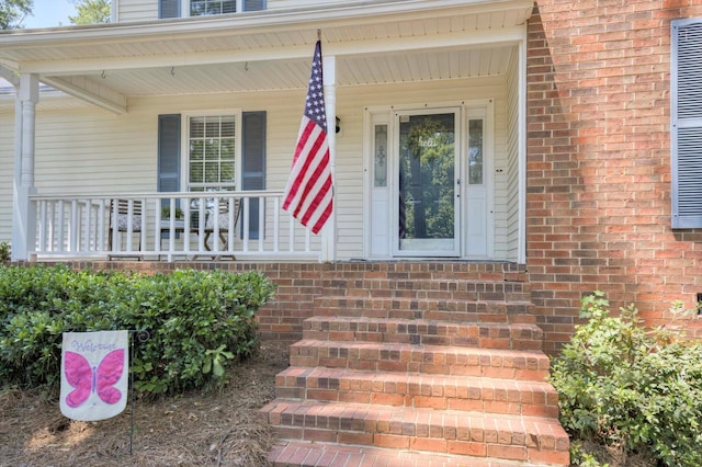 123 Sugar Maple Ln, Martinez, GA 30907 - doorway to property featuring a porch and brick siding