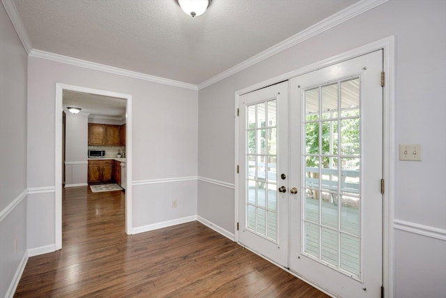 123 Sugar Maple Ln, Martinez, GA 30907 - doorway to outside featuring french doors, dark wood-type flooring, ornamental molding, and a textured ceiling