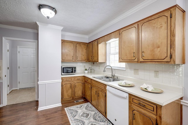 123 Sugar Maple Ln, Martinez, GA 30907 - kitchen featuring dishwasher, stainless steel microwave, dark wood-type flooring, brown cabinets, and decorative backsplash