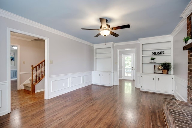 123 Sugar Maple Ln, Martinez, GA 30907 - unfurnished living room featuring a ceiling fan, stairs, dark wood-style floors, wainscoting, and ornamental molding