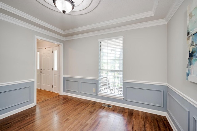123 Sugar Maple Ln, Martinez, GA 30907 - unfurnished room featuring crown molding, wood finished floors, wainscoting, and a decorative wall