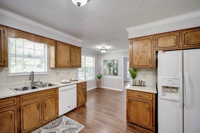 123 Sugar Maple Ln, Martinez, GA 30907 - kitchen featuring white appliances, brown cabinetry, tasteful backsplash, light countertops, and a textured ceiling