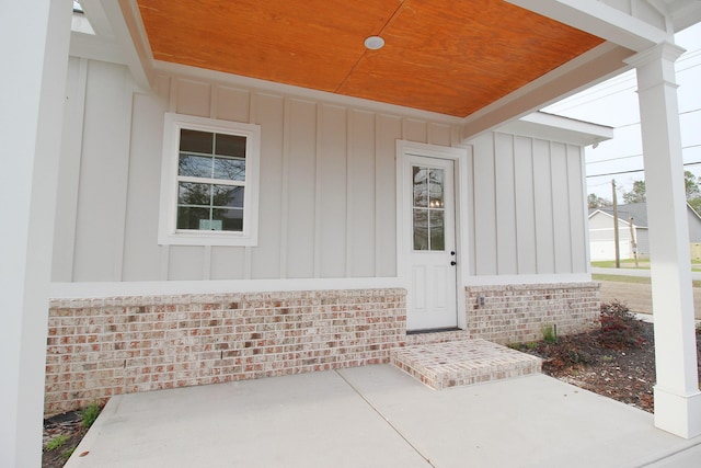 entrance to property with a patio