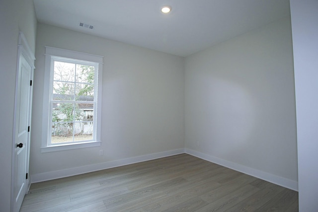 unfurnished room featuring light hardwood / wood-style flooring