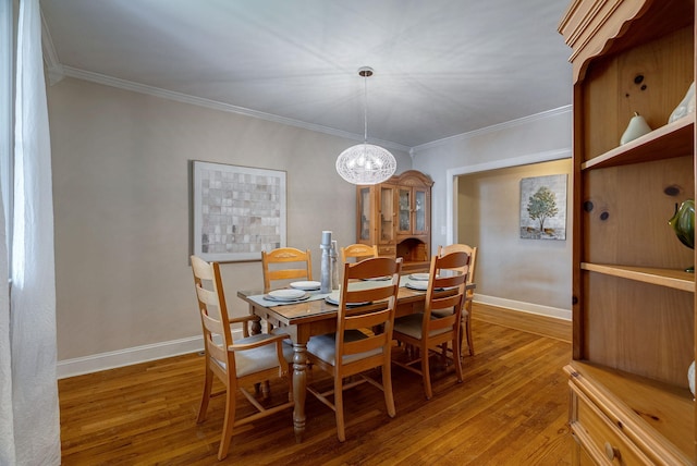 3011 Fox Spring Rd, Augusta, GA 30909 - dining space featuring wood finished floors, a chandelier, and crown molding