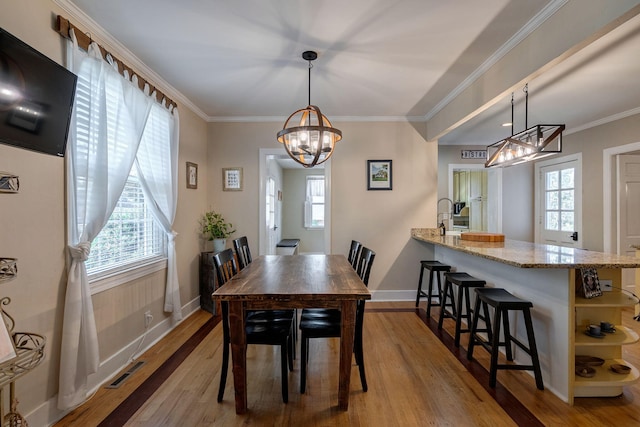 3011 Fox Spring Rd, Augusta, GA 30909 - dining space featuring a chandelier, hardwood / wood-style flooring, and ornamental molding