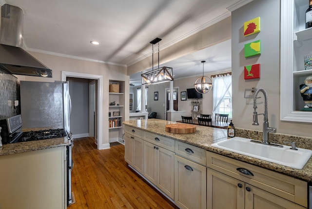 3011 Fox Spring Rd, Augusta, GA 30909 - kitchen with island range hood, stainless steel appliances, wood finished floors, crown molding, and a peninsula