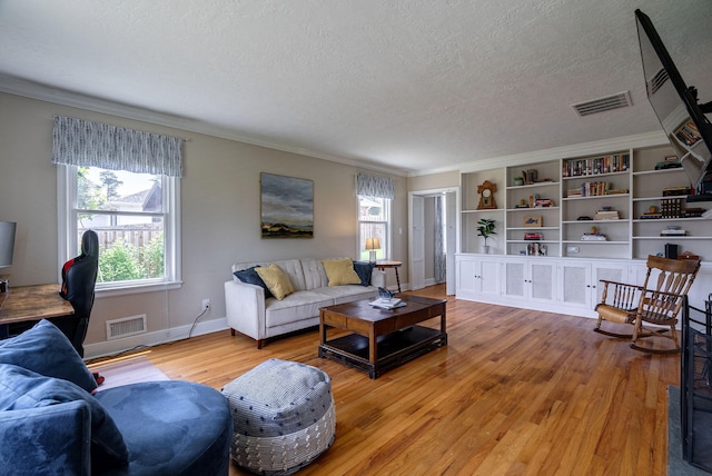3011 Fox Spring Rd, Augusta, GA 30909 - living area with a textured ceiling, light wood-type flooring, and crown molding