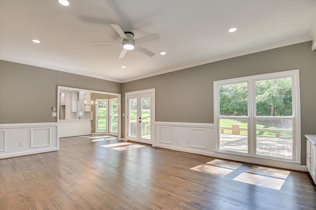 4 Shadowmoor Ct, North Augusta, SC 29841 - unfurnished living room featuring ceiling fan, french doors, a decorative wall, wood finished floors, and crown molding