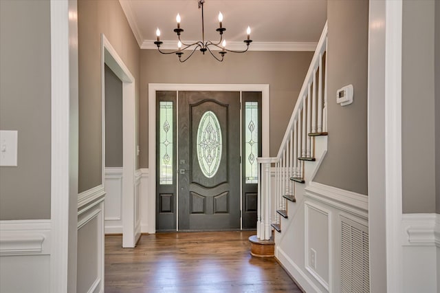 4 Shadowmoor Ct, North Augusta, SC 29841 - entryway featuring a decorative wall, crown molding, a chandelier, wood finished floors, and stairs