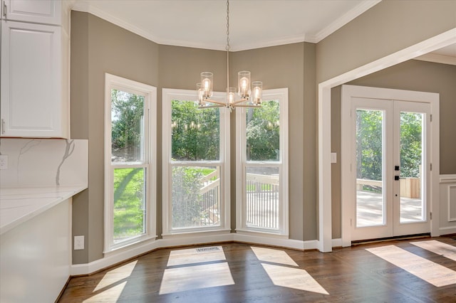 4 Shadowmoor Ct, North Augusta, SC 29841 - unfurnished dining area with dark wood-type flooring, french doors, a chandelier, and crown molding