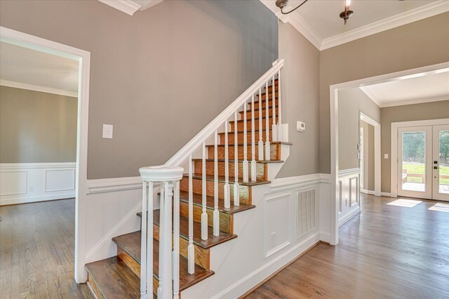 4 Shadowmoor Ct, North Augusta, SC 29841 - stairway featuring ornamental molding, wood finished floors, french doors, and wainscoting