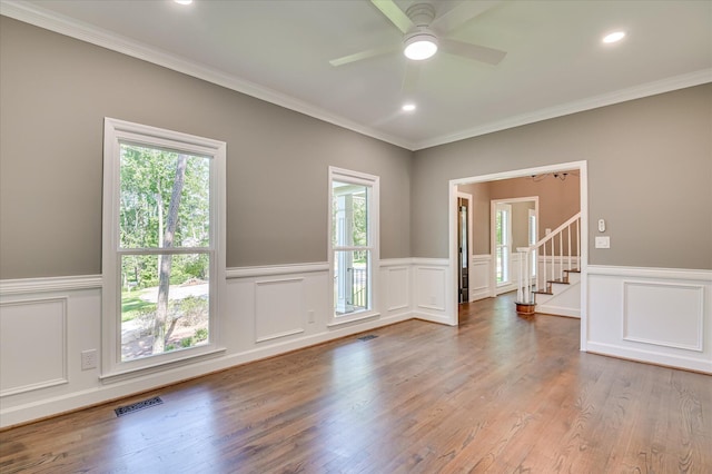 4 Shadowmoor Ct, North Augusta, SC 29841 - unfurnished room with plenty of natural light, wainscoting, a decorative wall, stairs, and a ceiling fan