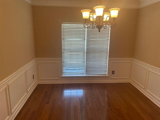 507 Julia Ct, Grovetown, GA 30813 - unfurnished dining area featuring a chandelier, a decorative wall, a wainscoted wall, and dark wood-style floors