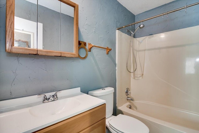 full bathroom featuring bathing tub / shower combination, vanity, a textured ceiling, and toilet