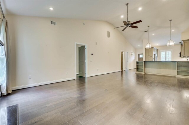 interior space with ceiling fan, high vaulted ceiling, and hardwood / wood-style flooring