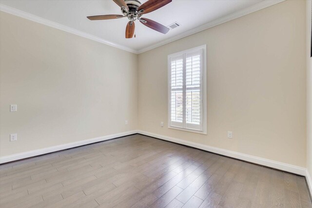 spare room featuring light hardwood / wood-style flooring, ceiling fan, and crown molding