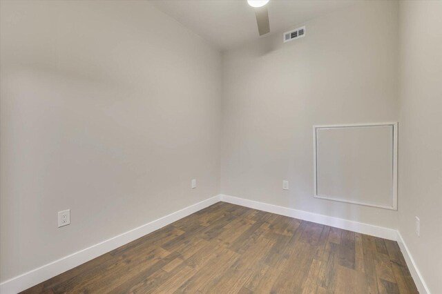 unfurnished room with dark hardwood / wood-style floors