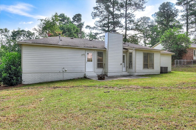 715 Gentlewind Ln, Martinez, GA 30907 - back of property with entry steps, a chimney, and a patio area