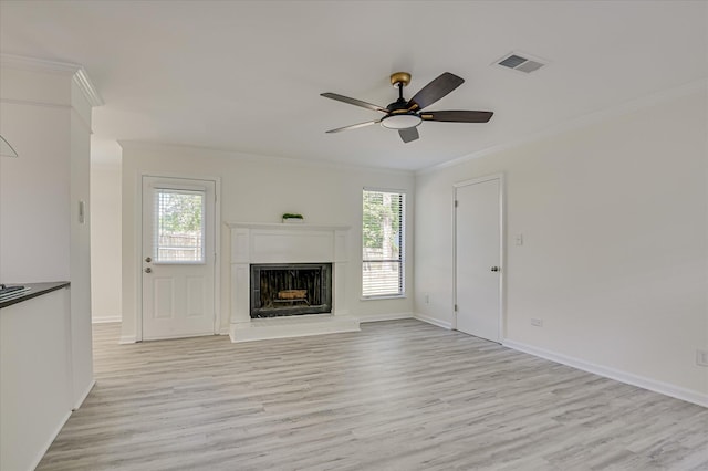 715 Gentlewind Ln, Martinez, GA 30907 - unfurnished living room with light wood-type flooring, crown molding, plenty of natural light, and a ceiling fan