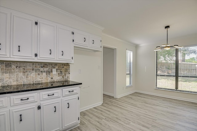 715 Gentlewind Ln, Martinez, GA 30907 - kitchen with white cabinets, crown molding, decorative backsplash, a ceiling fan, and light wood-style flooring