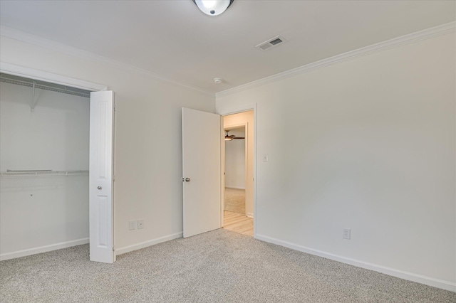 715 Gentlewind Ln, Martinez, GA 30907 - unfurnished bedroom with crown molding, carpet flooring, and a closet