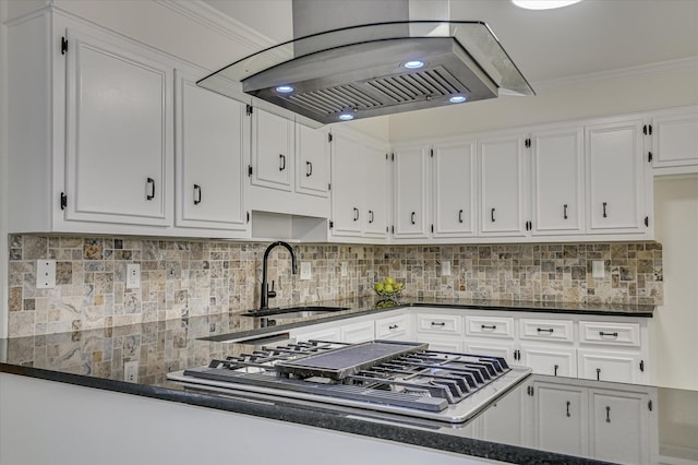 715 Gentlewind Ln, Martinez, GA 30907 - kitchen with range hood, stainless steel gas cooktop, white cabinets, tasteful backsplash, and ornamental molding