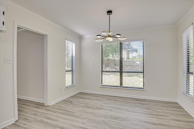 715 Gentlewind Ln, Martinez, GA 30907 - unfurnished room with a chandelier, light wood-style flooring, and crown molding